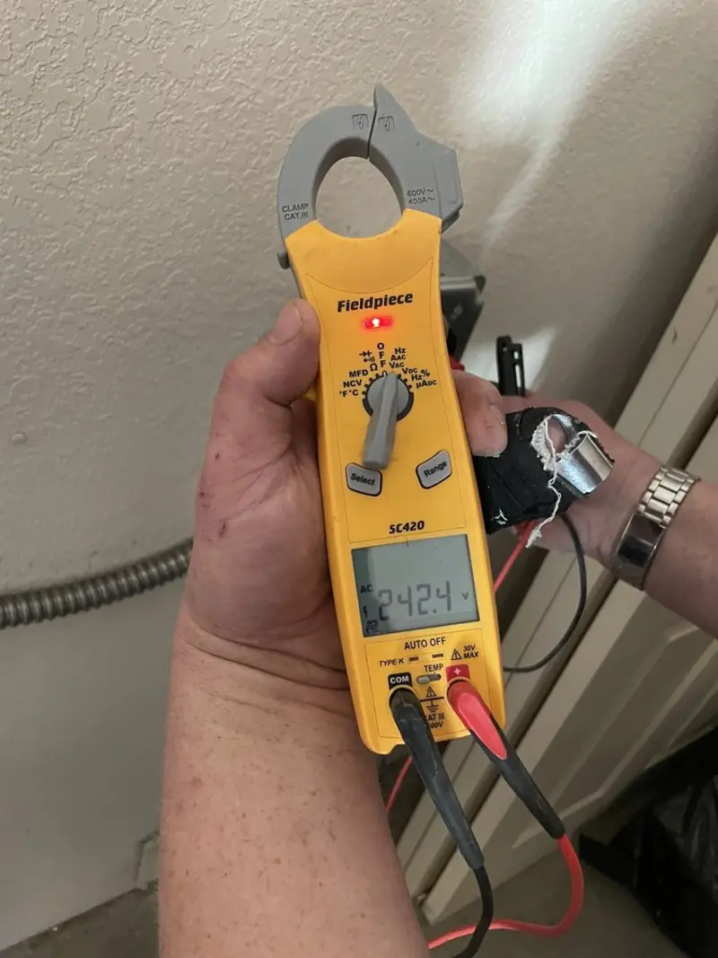 Voltage testing with clamp meter during Electrical Installation Services in Bloomington
